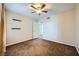 Bedroom features neutral color palette, ceiling fan, and shelving at 4400 S Jones Blvd # 2007, Las Vegas, NV 89103