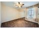 Spacious bedroom featuring mirrored closet doors and a ceiling fan at 4400 S Jones Blvd # 2007, Las Vegas, NV 89103