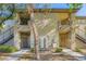 Inviting condo exterior featuring well-kept landscaping and multiple units, creating a sense of community at 4400 S Jones Blvd # 2007, Las Vegas, NV 89103