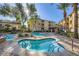 Community hot tub with lounge chairs and shade under blue sky at 4400 S Jones Blvd # 2007, Las Vegas, NV 89103