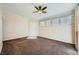Cozy living room featuring plush carpeting, ceiling fan, neutral decor, and ample natural light at 4400 S Jones Blvd # 2007, Las Vegas, NV 89103