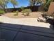 Backyard featuring a patio, rock garden, and decorative plants surrounded by a fence at 4814 Regalo Bello St, Las Vegas, NV 89135