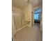 Spacious bathroom featuring a shower, tile flooring, and a glimpse into the bedroom at 4814 Regalo Bello St, Las Vegas, NV 89135