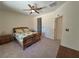 Comfortable bedroom with a ceiling fan, carpet flooring and a closet for storage at 4814 Regalo Bello St, Las Vegas, NV 89135