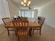 Cozy dining area featuring an elegant chandelier and natural light at 4814 Regalo Bello St, Las Vegas, NV 89135