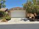 Charming home featuring a two-car garage and well-maintained landscaping at 4814 Regalo Bello St, Las Vegas, NV 89135
