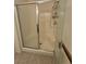 A shower with a glass door and tiled walls is clean and ready for use at 4814 Regalo Bello St, Las Vegas, NV 89135
