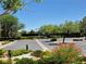 Community tennis court with parking featuring beautiful landscaping and trees providing shade and scenic views at 4814 Regalo Bello St, Las Vegas, NV 89135