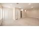 Large bedroom with carpeting and dual closets at 5110 N Valadez St, Las Vegas, NV 89149