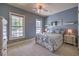 Serene bedroom with a metal bed frame, neutral carpet, and natural light, creating a calm retreat at 5110 N Valadez St, Las Vegas, NV 89149