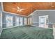 Spacious bedroom with a wood ceiling, three ceiling fans, and access to a balcony through glass doors at 5110 N Valadez St, Las Vegas, NV 89149