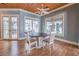 Cozy dining area with a round table, french doors, and wood flooring at 5110 N Valadez St, Las Vegas, NV 89149