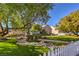 Beautifully landscaped front yard with lush greenery and a charming stone bridge at 5110 N Valadez St, Las Vegas, NV 89149