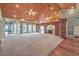 Expansive great room with a high ceiling, brick accents, and a seamless flow to other living spaces at 5110 N Valadez St, Las Vegas, NV 89149
