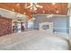 Spacious great room with carpet, wooden ceiling, and built-in shelving for storage at 5110 N Valadez St, Las Vegas, NV 89149