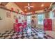 Fun retro room with a black and white checkered floor, Coca-Cola decor, and vintage furnishings at 5110 N Valadez St, Las Vegas, NV 89149
