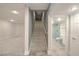 A carpeted staircase between the basement and first floor, adjacent to a bathroom at 5110 N Valadez St, Las Vegas, NV 89149