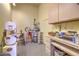 This workshop features an organized space with tools, work surfaces, and ample storage cabinets at 5110 N Valadez St, Las Vegas, NV 89149