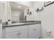 Bathroom featuring a granite countertop vanity and a large mirror at 527 Clearsable Ave, Henderson, NV 89044