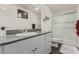 Bathroom featuring a glass enclosed shower, modern vanity, and neutral decor at 527 Clearsable Ave, Henderson, NV 89044