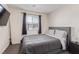 Comfortable bedroom with a large window providing bright, natural light at 527 Clearsable Ave, Henderson, NV 89044