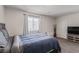 Bedroom with a comfortable bed and furniture, enhanced by natural light at 527 Clearsable Ave, Henderson, NV 89044