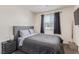 Comfortable bedroom with a large window providing bright, natural light at 527 Clearsable Ave, Henderson, NV 89044