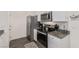 Modern kitchen features granite countertops, and stainless steel appliances at 527 Clearsable Ave, Henderson, NV 89044