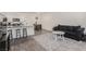 Open concept living room with kitchen bar, sleek appliances, and comfortable seating area at 527 Clearsable Ave, Henderson, NV 89044