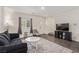 Living room with a dark sofa and modern decor, showing a bright and inviting space at 527 Clearsable Ave, Henderson, NV 89044