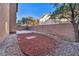 Private backyard with gravel and rock landscaping, bordered by a block wall for added seclusion at 5308 Carlsbad Heights St, North Las Vegas, NV 89081