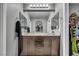 Bathroom featuring a double sink vanity, ample lighting, and access to a closet at 5308 Carlsbad Heights St, North Las Vegas, NV 89081