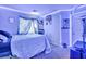 Teen bedroom with blue LED lighting, decorative art, and basketball hoop at 5308 Carlsbad Heights St, North Las Vegas, NV 89081