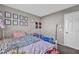 bedroom with playful wall decor, cozy carpet, and whimsical fairy lights for a magical touch at 5308 Carlsbad Heights St, North Las Vegas, NV 89081