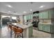Bright kitchen with stainless steel appliances, breakfast bar, and ample cabinet space for storage at 5308 Carlsbad Heights St, North Las Vegas, NV 89081