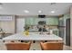 Kitchen with stainless steel appliances and a large island, perfect for food preparation and casual dining at 5308 Carlsbad Heights St, North Las Vegas, NV 89081