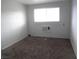 Modest bedroom features carpeted flooring, window with blinds, and an A/C unit at 5388 Swenson St # 26, Las Vegas, NV 89119