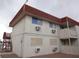Exterior shot of the apartments features a red roof and external A/C units at 5388 Swenson St # 26, Las Vegas, NV 89119
