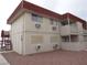 Apartment exterior with multiple windows, access stairs and balcony with neutral paint at 5388 Swenson St # 26, Las Vegas, NV 89119