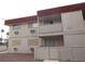 Building exterior featuring multiple windows, balcony, and access stairs at 5388 Swenson St # 26, Las Vegas, NV 89119