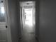 Bright hallway leads to rooms, showcasing tile flooring and neutral wall color at 5388 Swenson St # 26, Las Vegas, NV 89119