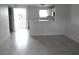 Bright living room featuring tile flooring and neutral walls, and kitchen access at 5388 Swenson St # 26, Las Vegas, NV 89119