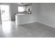 Open living space with tile flooring and a breakfast bar leading to the kitchen at 5388 Swenson St # 26, Las Vegas, NV 89119
