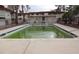 The pool's concrete border and clear water make it the perfect place to relax and cool off at 5388 Swenson St # 26, Las Vegas, NV 89119