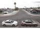 A view of a street with two cars parked and palm trees in the distance at 5388 Swenson St # 26, Las Vegas, NV 89119