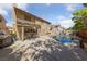 Spacious backyard with a pool, spa, covered patio and outdoor seating, perfect for entertaining at 5452 Desert Spring Rd, Las Vegas, NV 89149