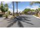 A gated community entrance provides security and privacy for residents, complete with well-maintained landscaping at 5452 Desert Spring Rd, Las Vegas, NV 89149