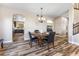 A cozy dining room with an open view to the kitchen and living area at 5452 Desert Spring Rd, Las Vegas, NV 89149