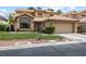 Charming two-story home with manicured lawn, desert landscaping, and a two-car garage at 5452 Desert Spring Rd, Las Vegas, NV 89149