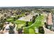 Aerial view of beautiful golf course community surrounded by houses and green trees at 5452 Desert Spring Rd, Las Vegas, NV 89149